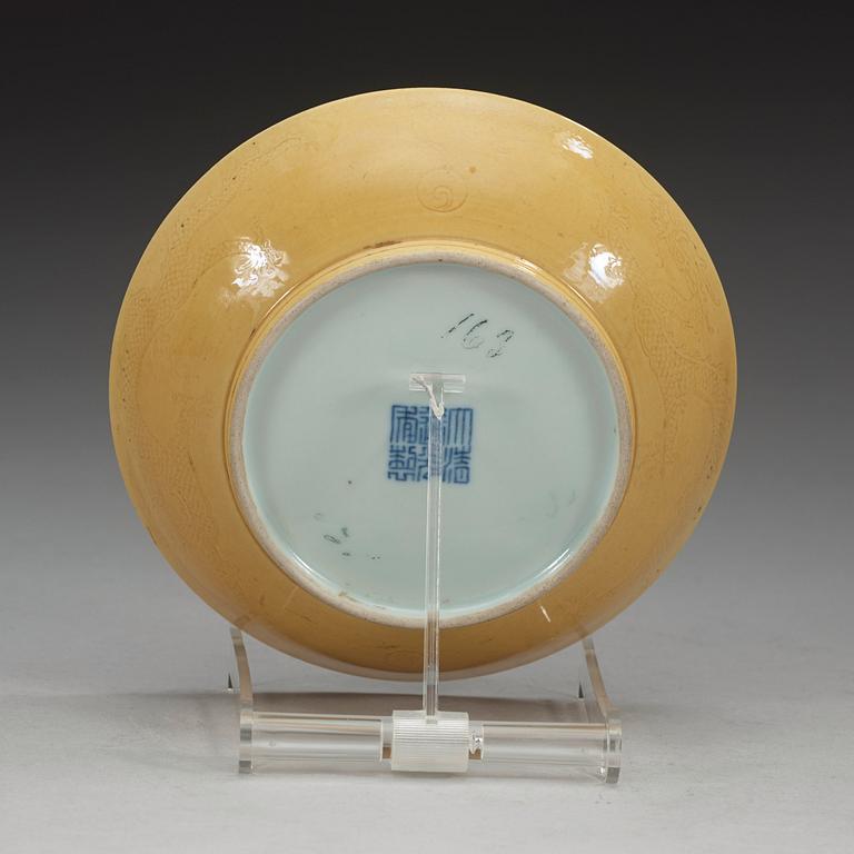 A Yellow glazed dish, Qing dynasty, with Daoguang seal mark and period (1821-1850).