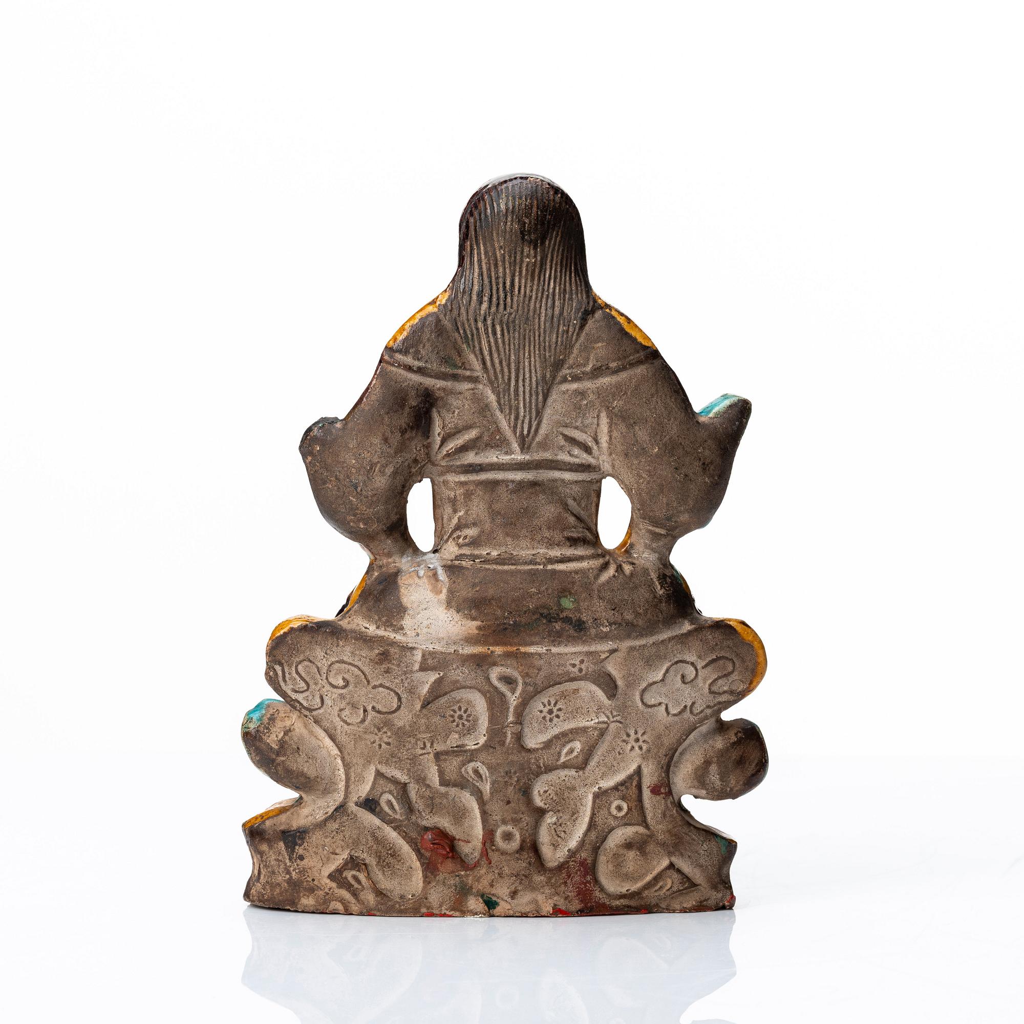 A pottery figure of a the warrior god Guandi, Ming dynasty (1368-1644).