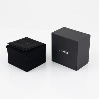 Chanel, a black acrylic bracelet with pearls, 2022.