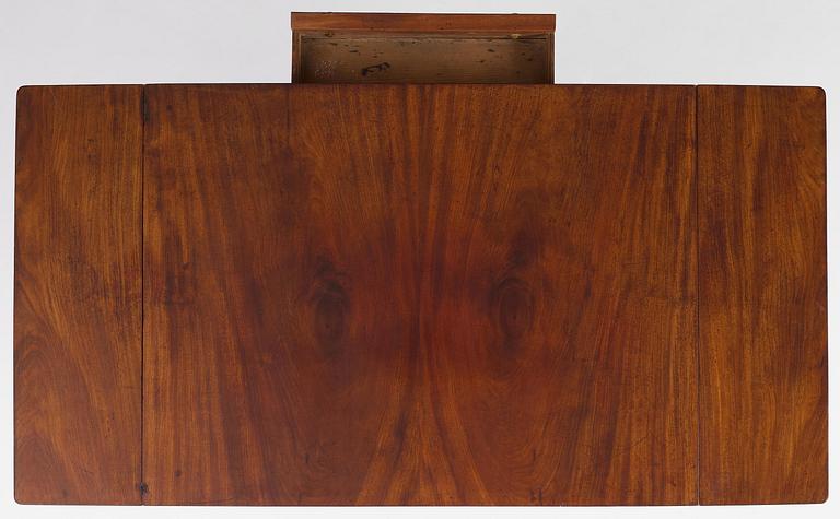 A Swedish Empire mahogany center table.