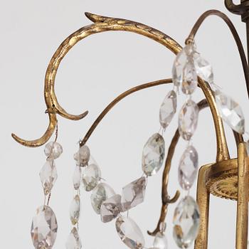 A German Louis XVI ormolu and cut-glass nine-light chandelier attributed to Johann Christoph Ermisch, late 18th century.