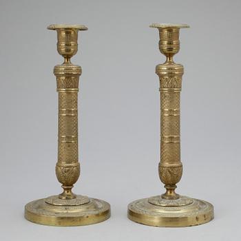 LJUSSTAKAR, ett par, brons. Empirestil 1800-tal.