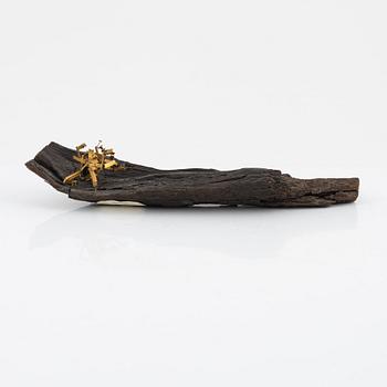 Arne Jones, sculpture, brass on driftwood, signed on label by the estate.