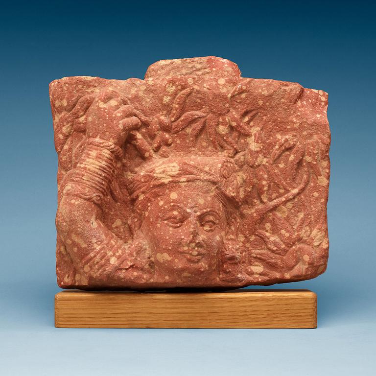 A red mottled sandstone relief of a Bodhisattva, Northern India, Mathura, Uttar Pradesh, presumably AD 2/3rd Century.