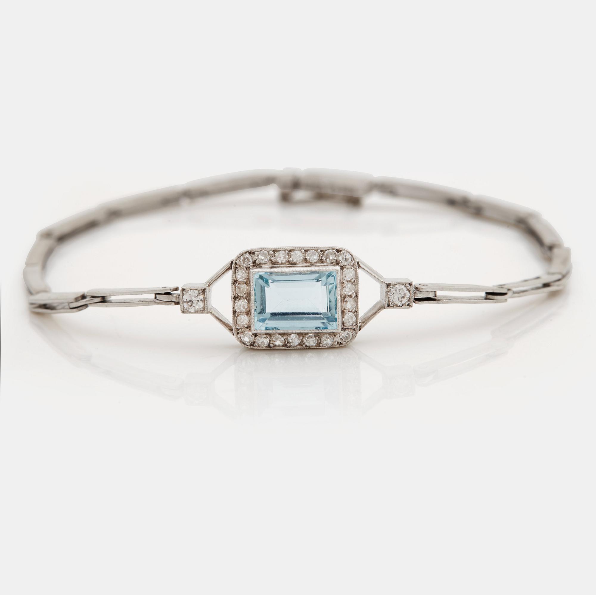 A step-cut aquamarine, old and single cut diamond bracelet.