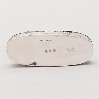 Four silver objects from the 20th Century.