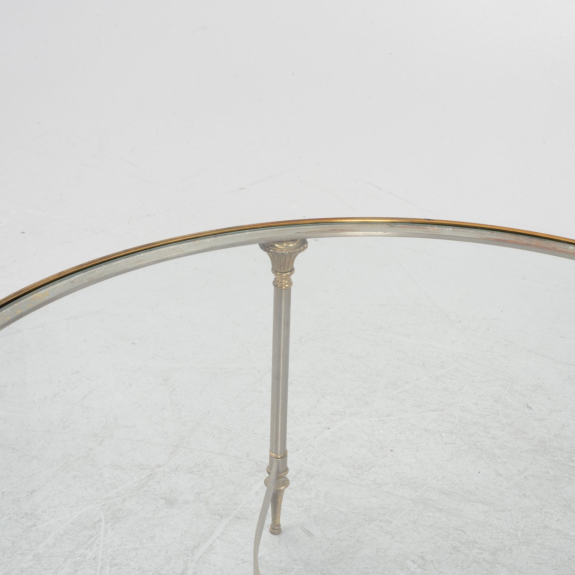 A steel and glass coffee table, Nordiska Kompaniet, end of the 20th Century.