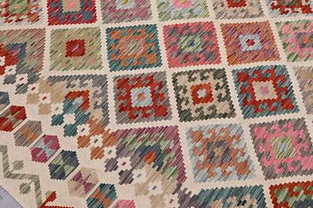 A Kilim carpet, approx. 355 x 252 cm.