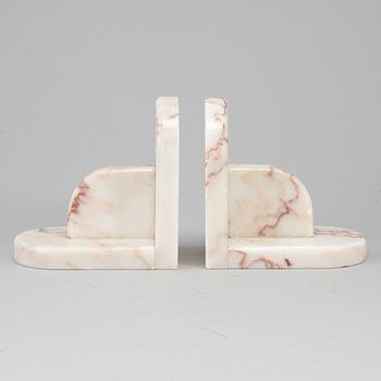 A pair of marble book ends, 20th century.