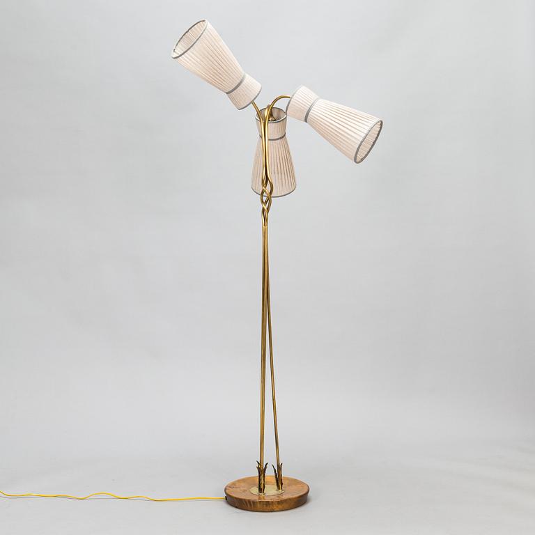 A three-arm floor lamp in brass, mid 20th century.