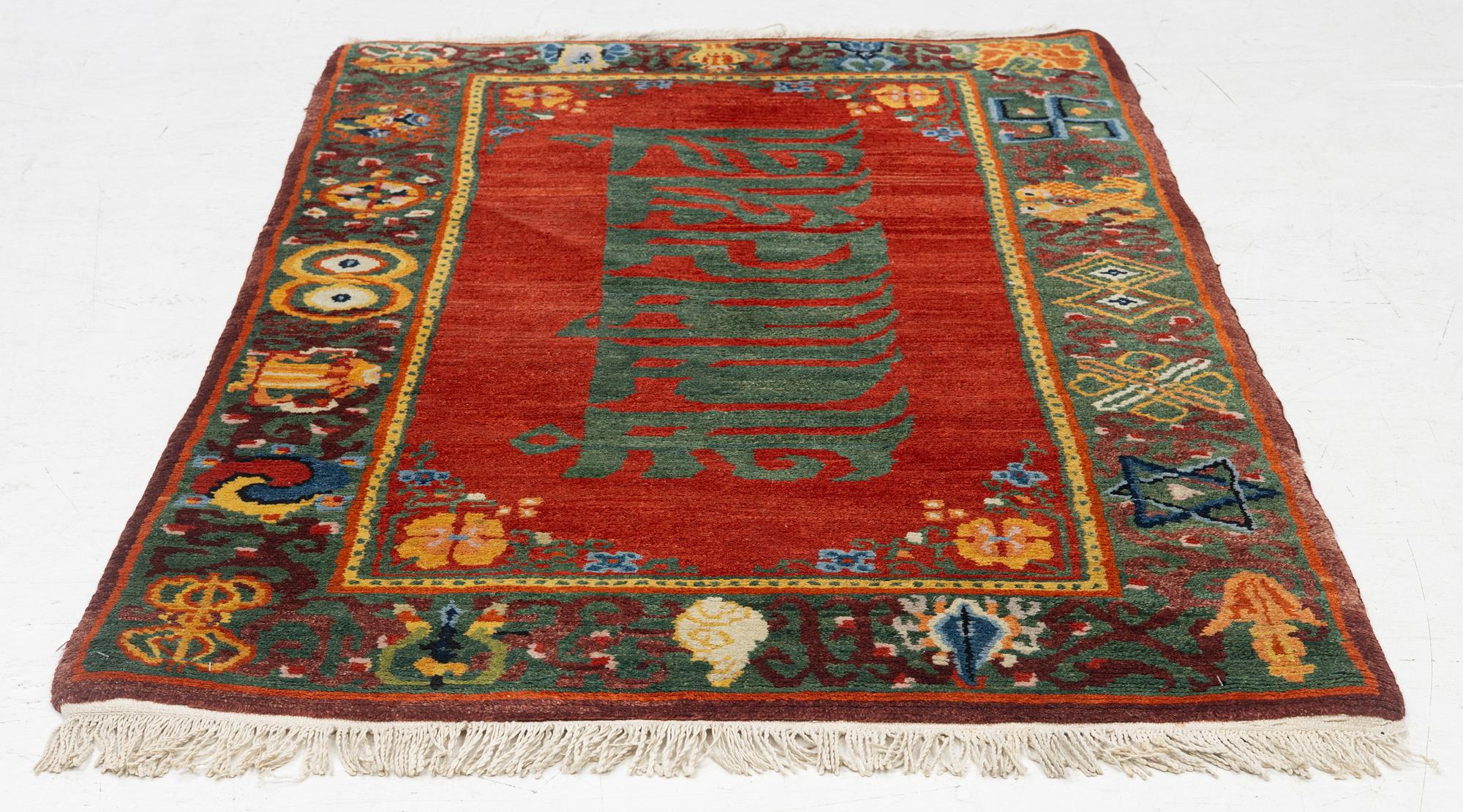 A Nepalese rug, c. 157 x 91cm.
