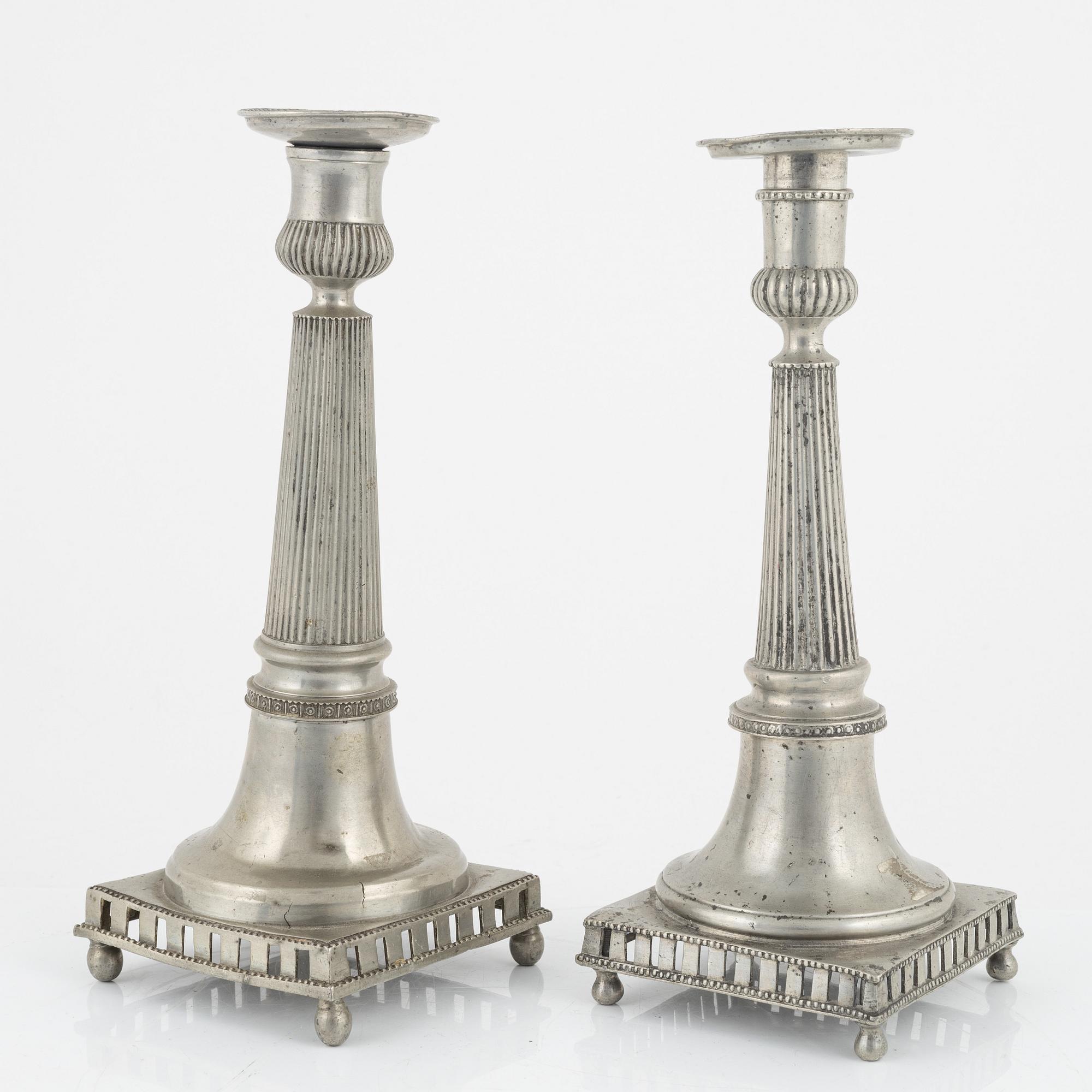 A matched pair of pewter candle sticks, 19th Century.