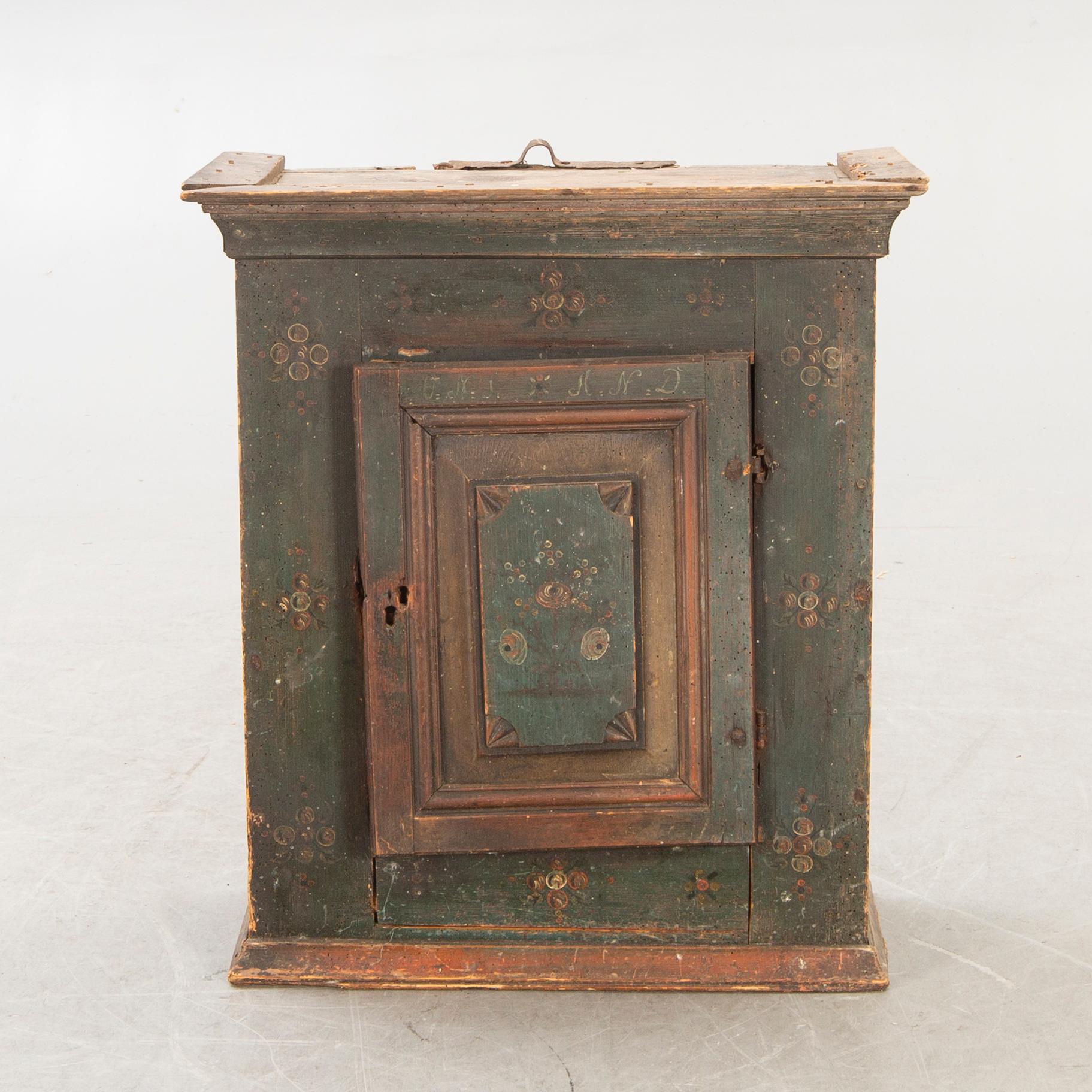 A Swedish painted wall cabinet around 1800.