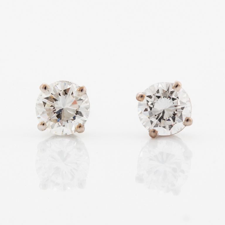 Brilliant-cut diamond earrings.