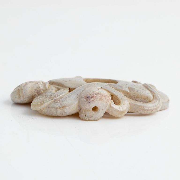 An archaistically carved nephrite sculpture, China, 20th Century.