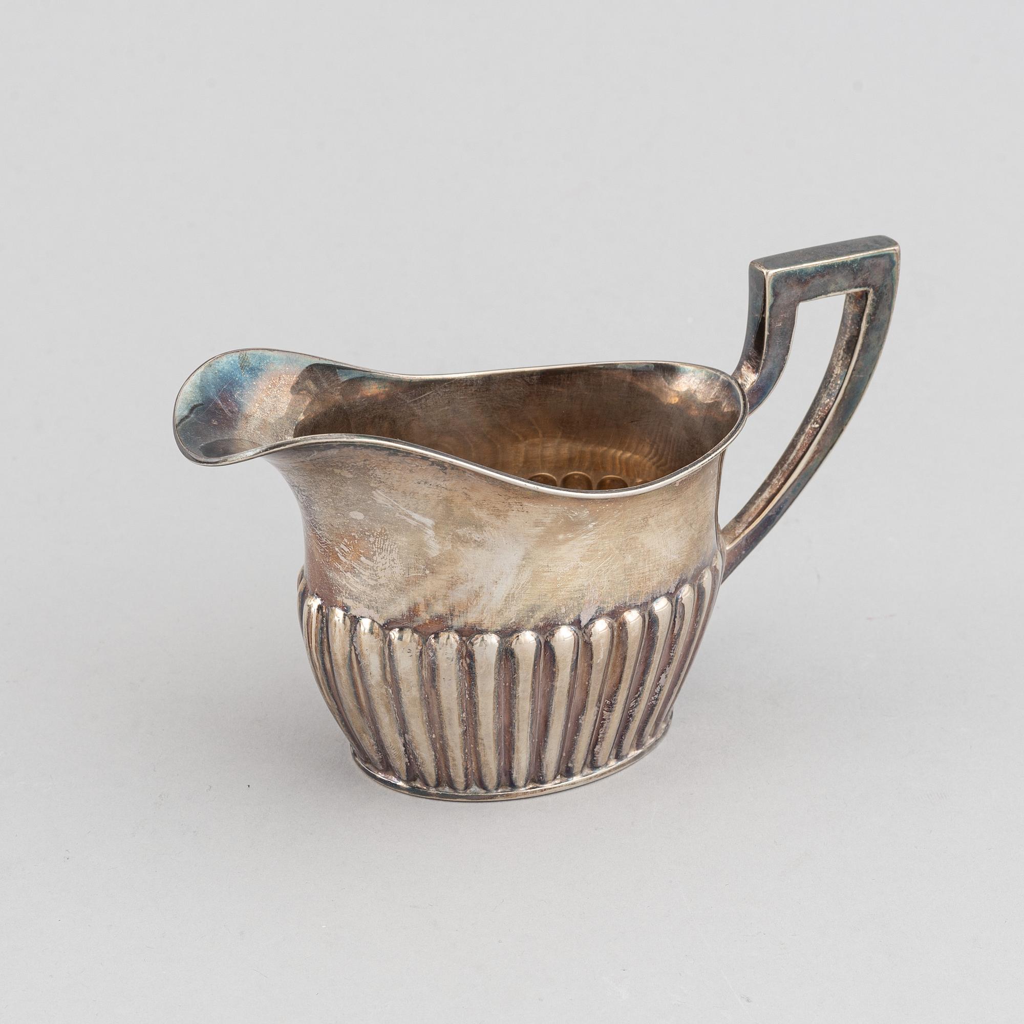 A silver coffee pot, creamer and sugar bowl, AG Dufva, Stockholm 1914.