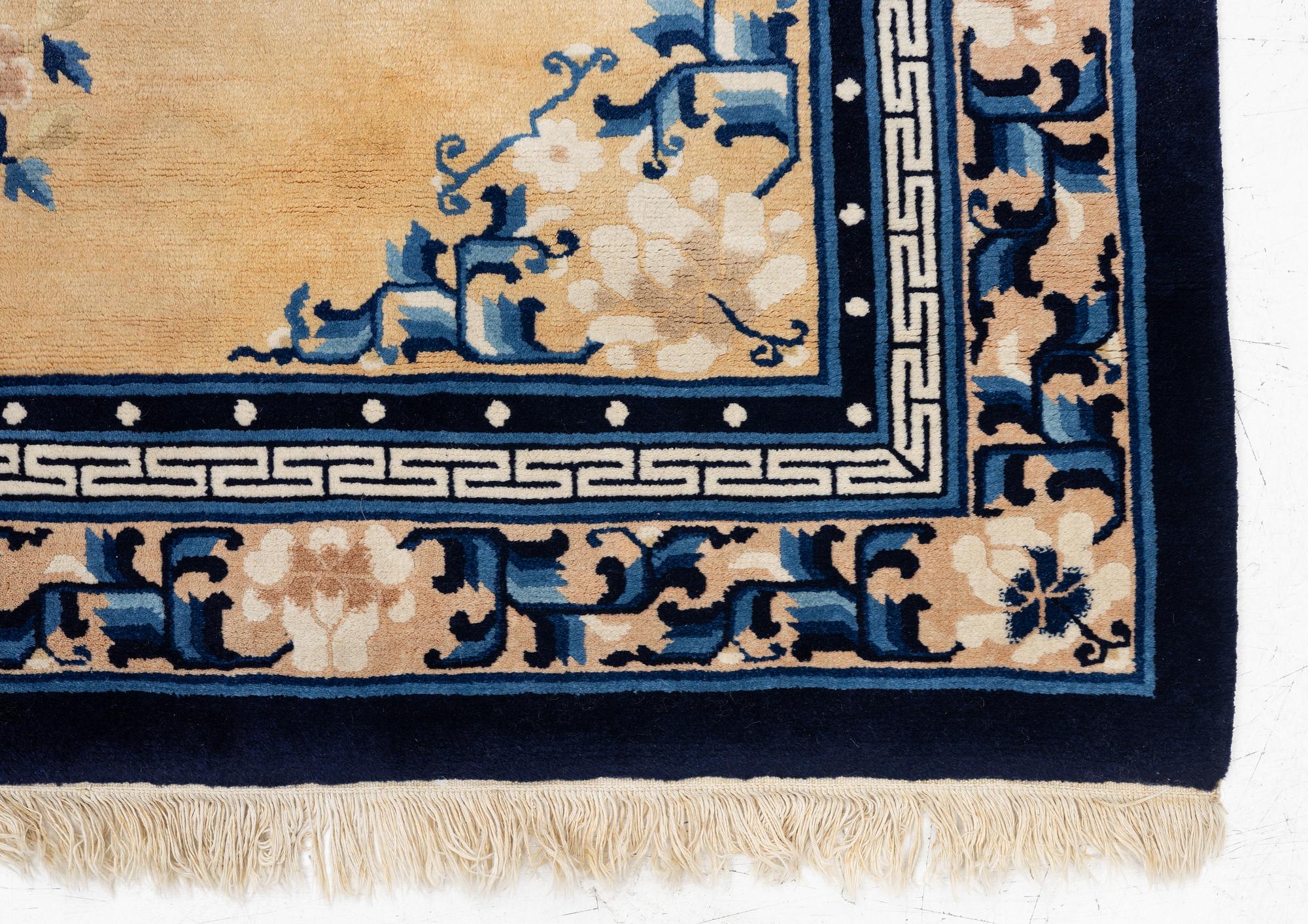 A semi-antique chinese rug, c. 195 x 132 cm .