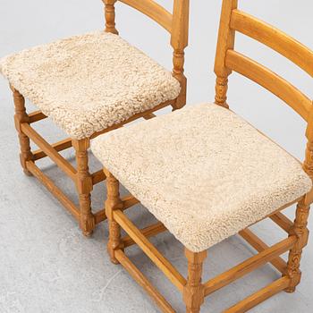 A set of eight pine chairs with new sheepskin upholstery, 1970s.