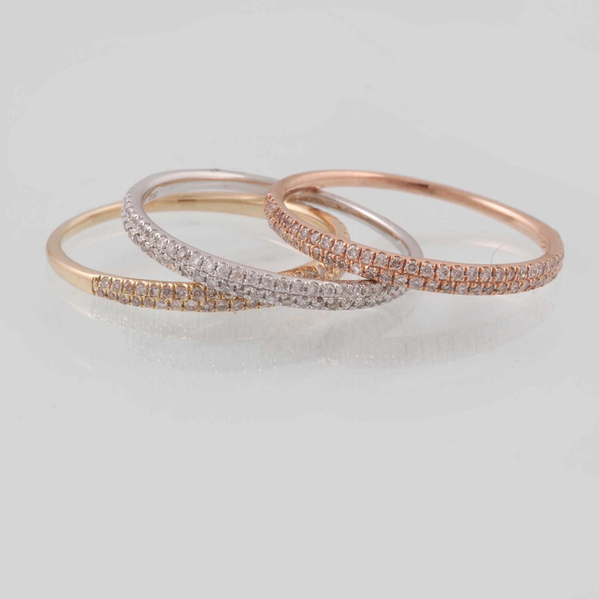 RINGAR, 3 st, 14K trefärgat guld med briljantslipade diamanter totalt ca 0.54 ct. Vikt 3,4 gram.