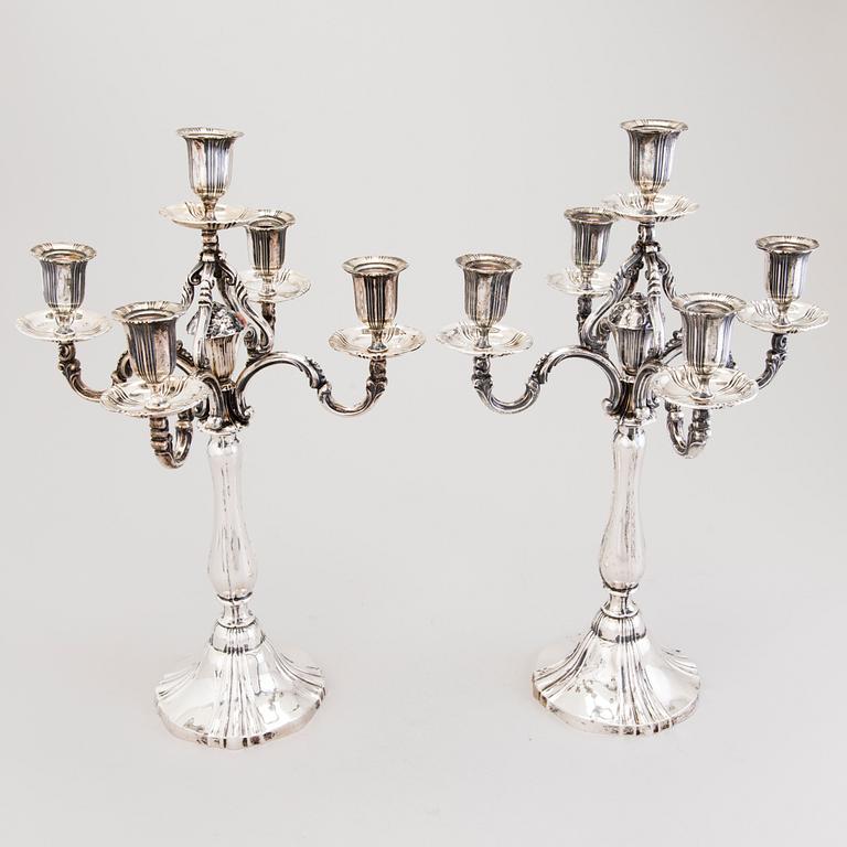 A pair of silver candelabra, presumably German, with Finnish control marks by Alexander Tillander, Helsinki.