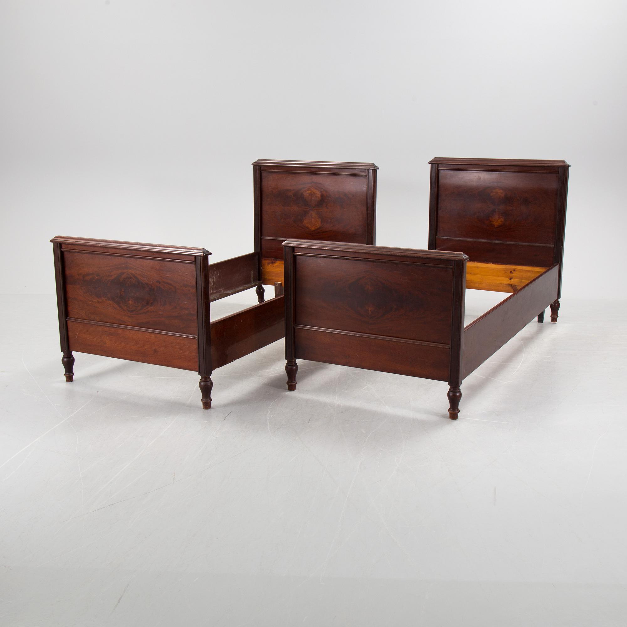 A pair of  mahognay veneered headboards from around year 1900.