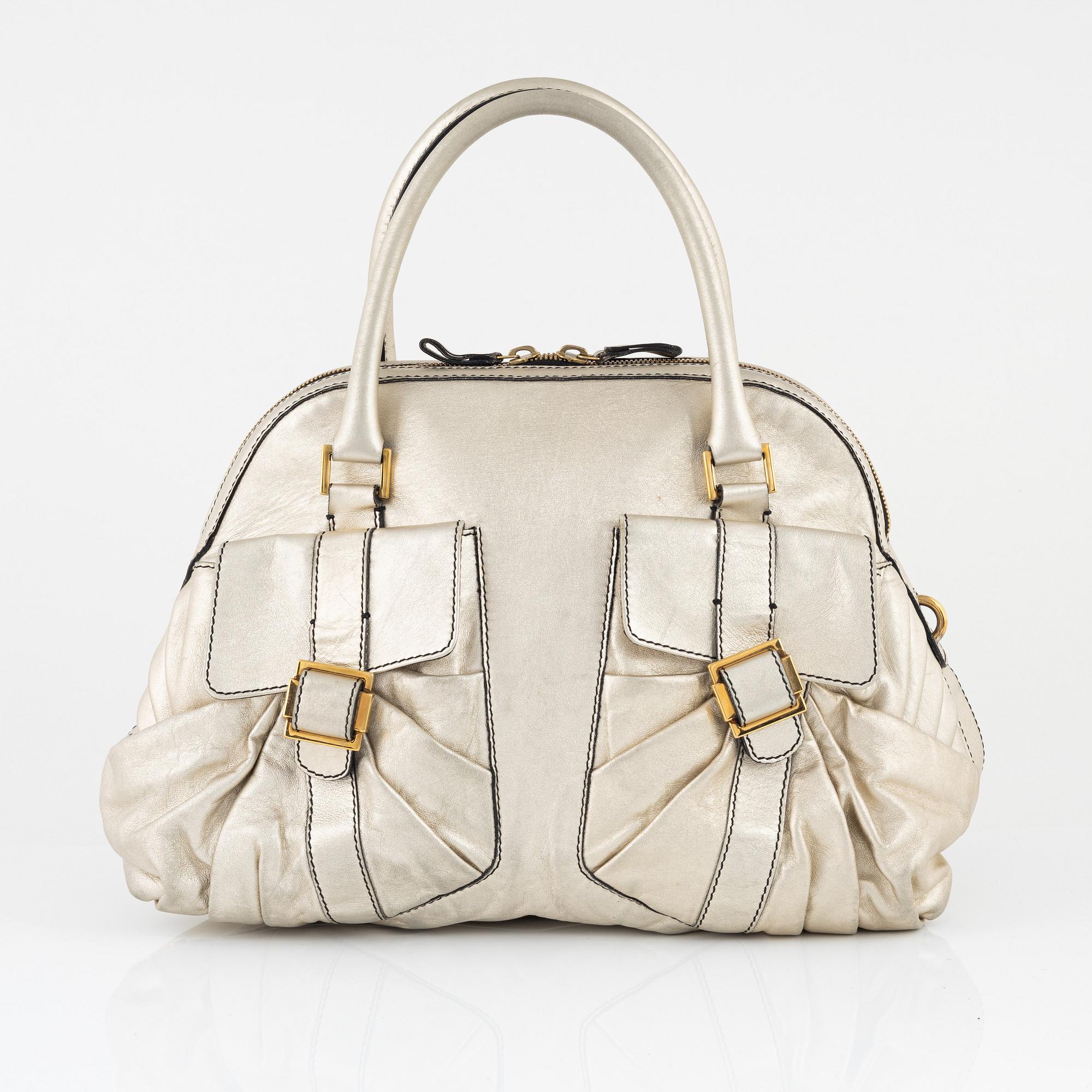 Valentino Garavani, A metallic leather bag.