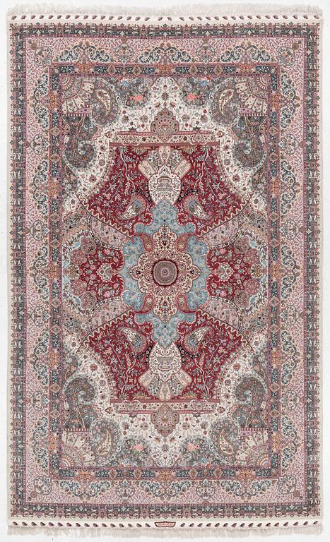 A Tabriz carpet, 210 x 195 cm. signed.