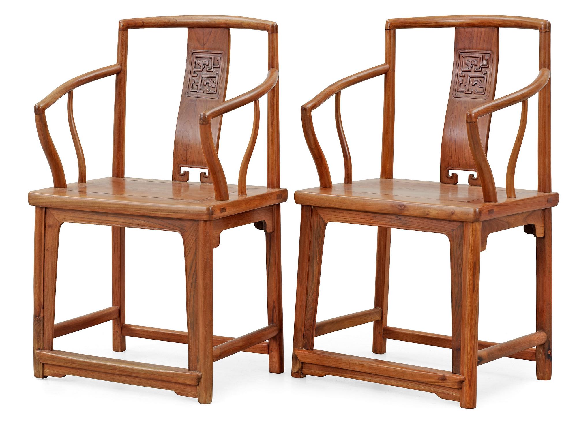 A pair of hardwood armchairs, Qing dynasty.
