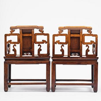 A pair of hardwood armchairs, late Qing dynasty.