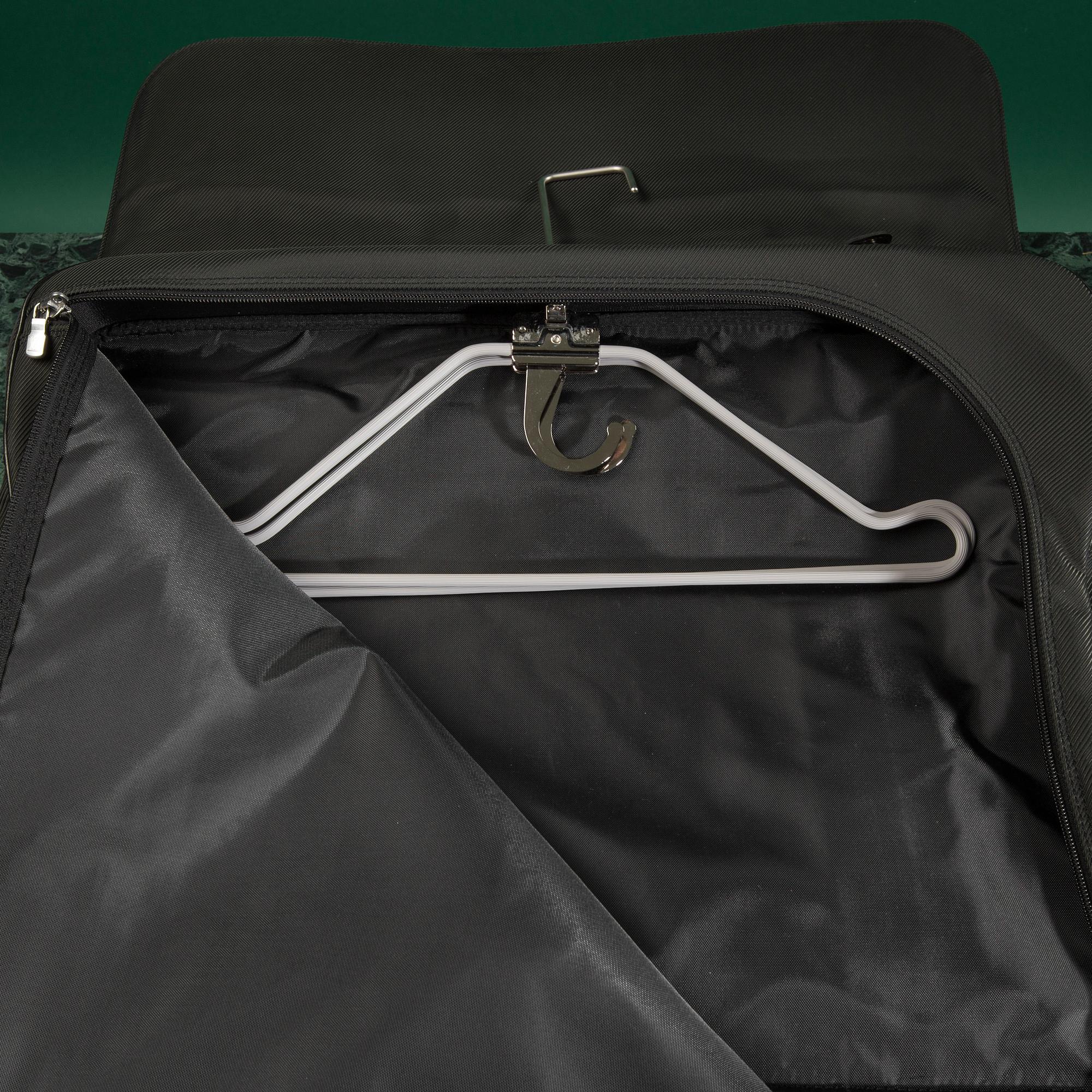 A Garment bag by Louis Vuitton.