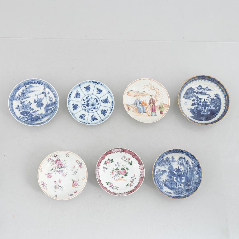 A creamer, seven porcelain cups and seven saucers, China, Qing dynasty, 18th century.
