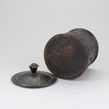 A cast iron lidded tobacco jar, 19th Century.