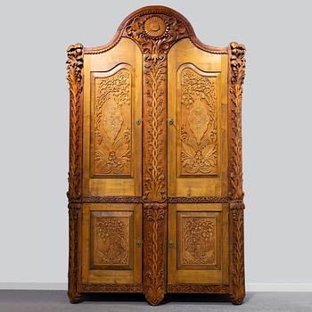 KNUT FJAESTAD, a folk art birch cabinet, early 20th century.