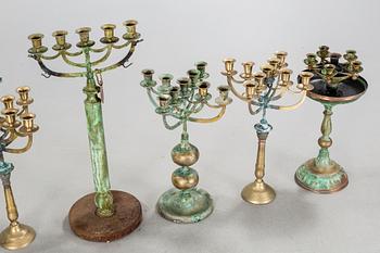 a metal sculpture group in eight parts, partly signed.