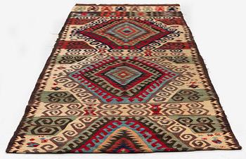 An antique Central Anatolian kilim, c. 273 x 101 cm.
