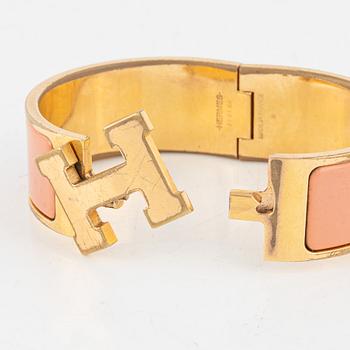 Hermès, a 'Clic Clac H' bracelet.