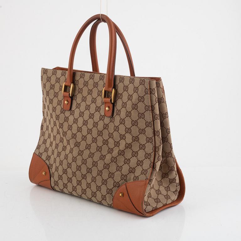 Gucci, a canvas and leather bag.