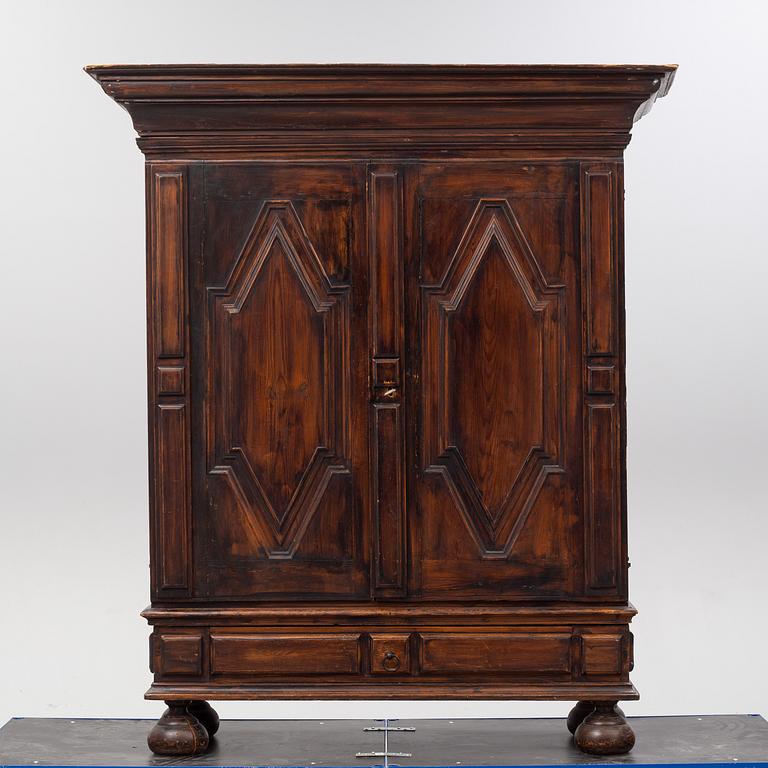 A first half of the 18th Century Baroque stained pine cabinet.
