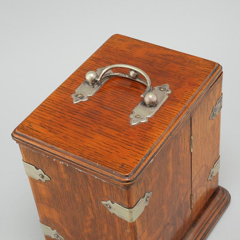 A small tobacco cabinet by BW & Co, early 20th century.