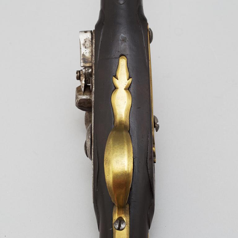 A 18th century flintlock pistol.
