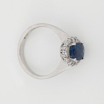 A circa 1.72 st sapphire and brilliant-cut diamond ring. Total carat weight of diamonds circa 0.56 ct.