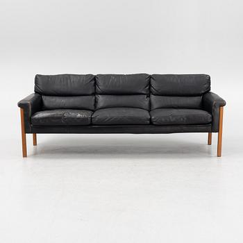 A leather and teak sofa, 1960-70s.