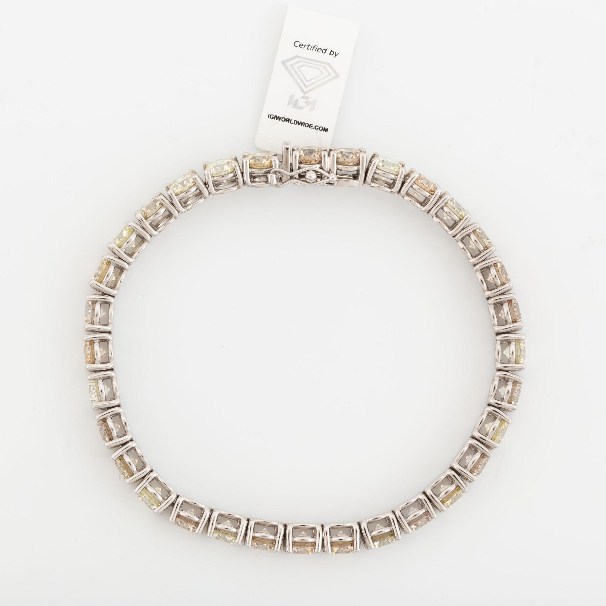 Round brilliant-cut diamond rivière bracelet, with IGI report.