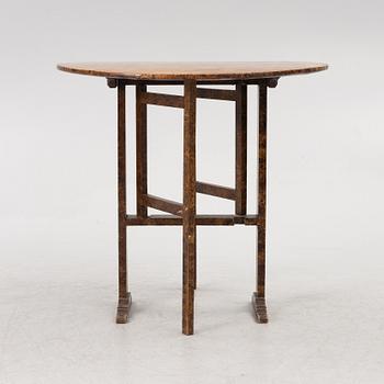 A folding table, 19th Century.