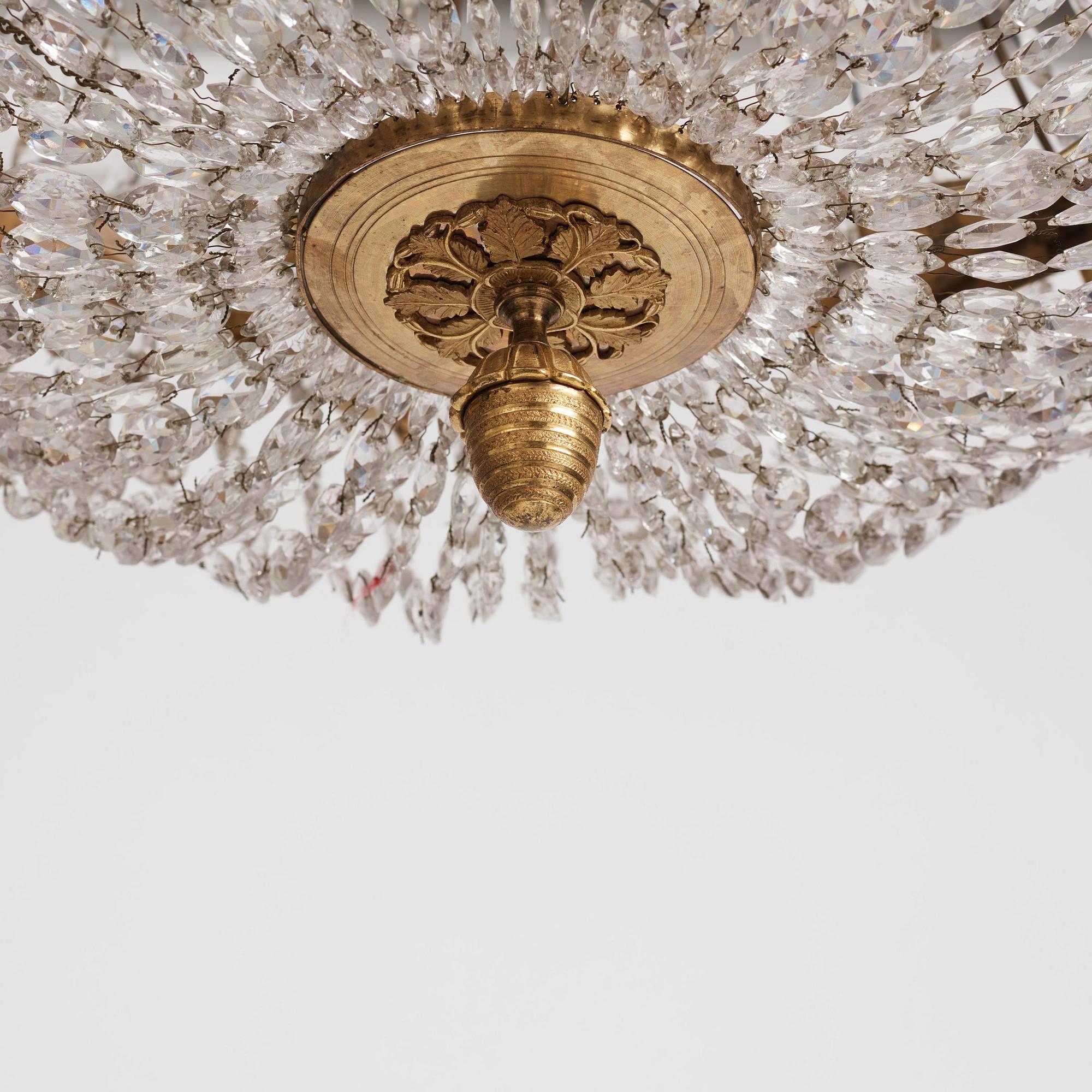 An Empire nine-light gilt-brass and cut-glass, Stockholm, early 19th century.