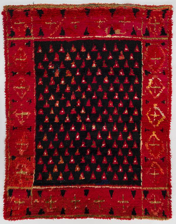 A late 19th Century Finnish folkart long pile ryijy-rug. Circa 175 x 135 cm.