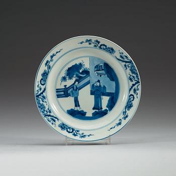 A set of four odd blue and white dinner plates, Qing dynasty, Kangxi (1662-1722), with different six character marks.