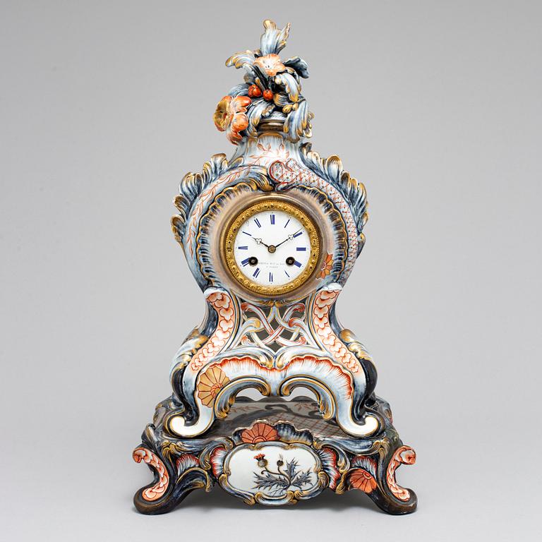 A new rococo creamware bracket clock, after Meissen model, early 20th century.