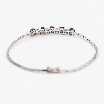 Armband, 14K vitguld, safirer, diamanter ca. 0.20 ct tot enl gravyr.