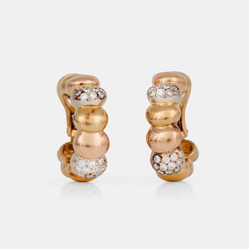 733. A pair of tricolor gold and diamond earrings.